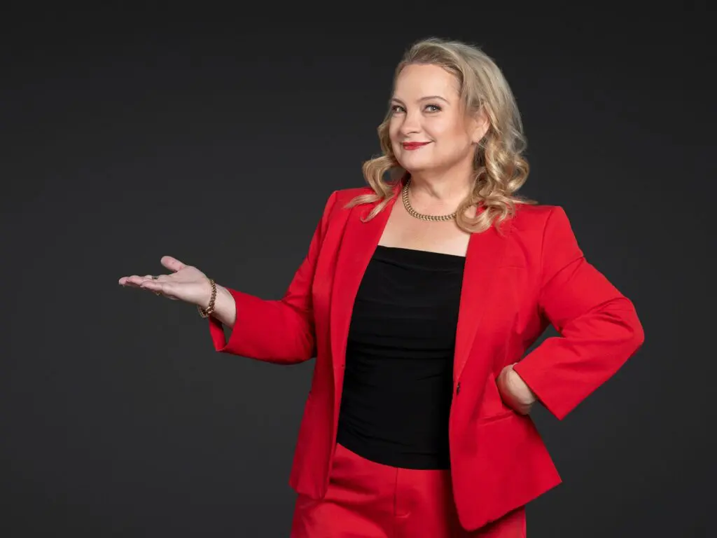 Juanita Wheeler, persuasion strategist and founder of Full & Frank, presenting with an open hand