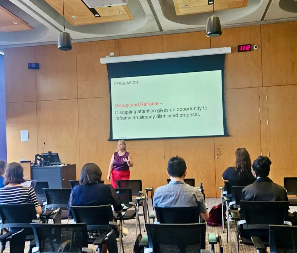 Juanita Wheeler delivering a professional development workshop on persuasion to UQ staff and researchers