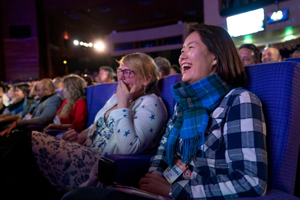 Audience members laughing at TEDSummit: A Community Beyond Borders. July 21-25, 2019, Edinburgh, Scotland. Photo: Ryan Lash / TED